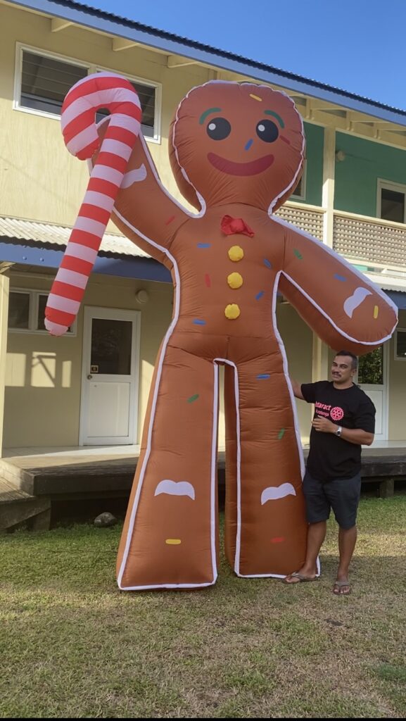 Rotaract Rarotonga president Byron Brown with a giant inflatable gingerbread man - one of the many attractions at the upcoming Rotaract Christmas in the Park. SUPPLIED/22120237