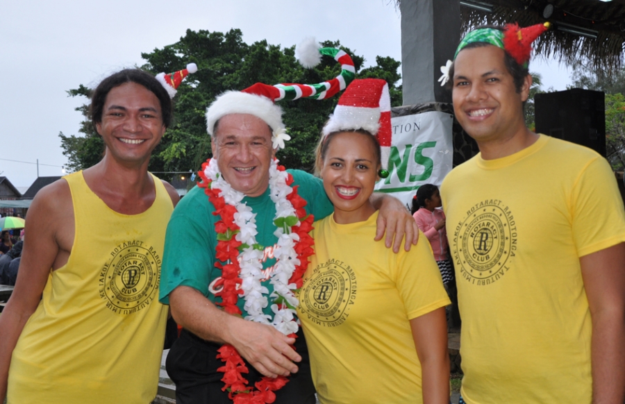 Elves play in tropical Christmas rain