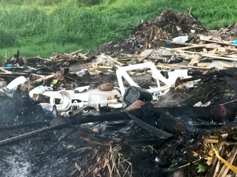 Plastic-burning site given a clean-up